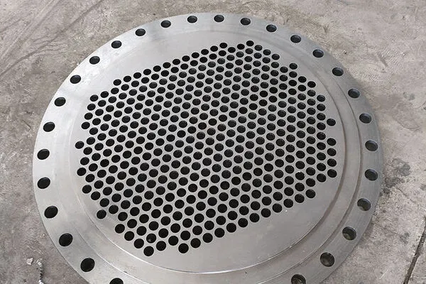 Titanium alloy tube plate for heat exchangers Titanium alloy tube plate for heat exchangers